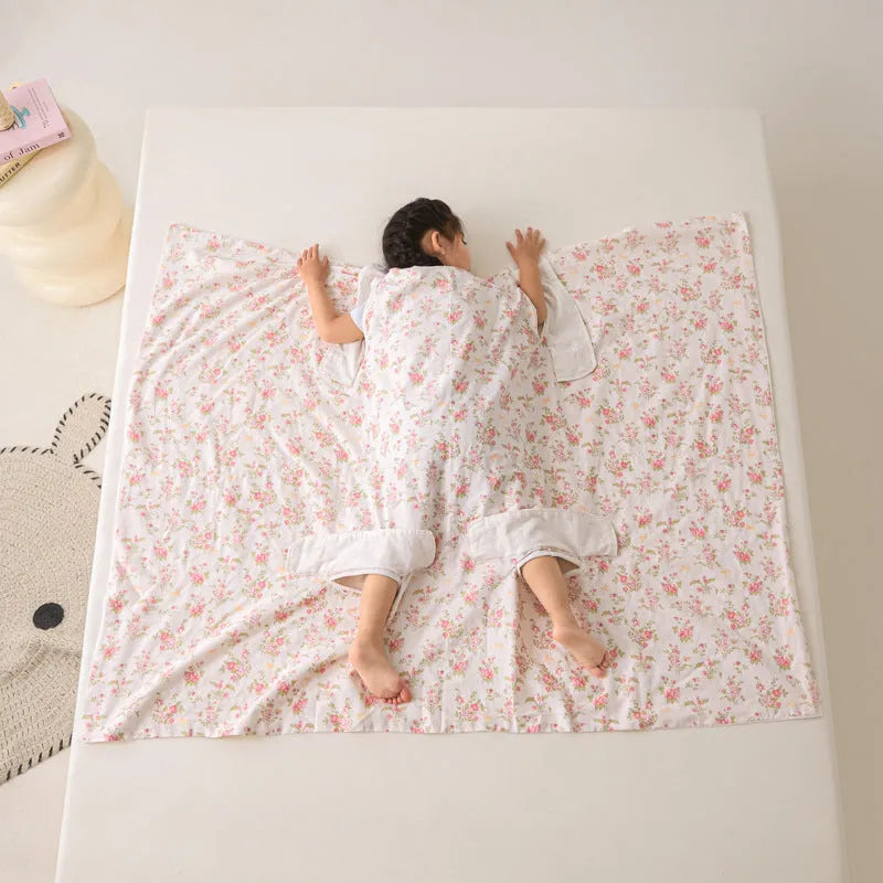 Anti-kick sleeping bag blanket in a choice of colours and sizes on a bed.