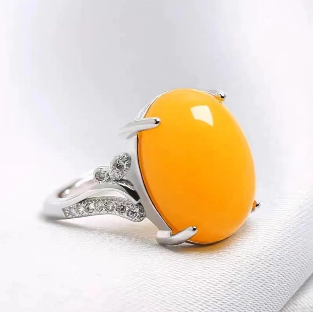 Adjustable geometric alloy ring with a natural sapphire style, shown in multiple colour options.