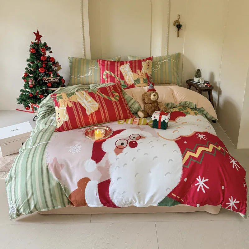 Cartoon Christmas duvet cover and pillowcase set in red and green on a bed.
