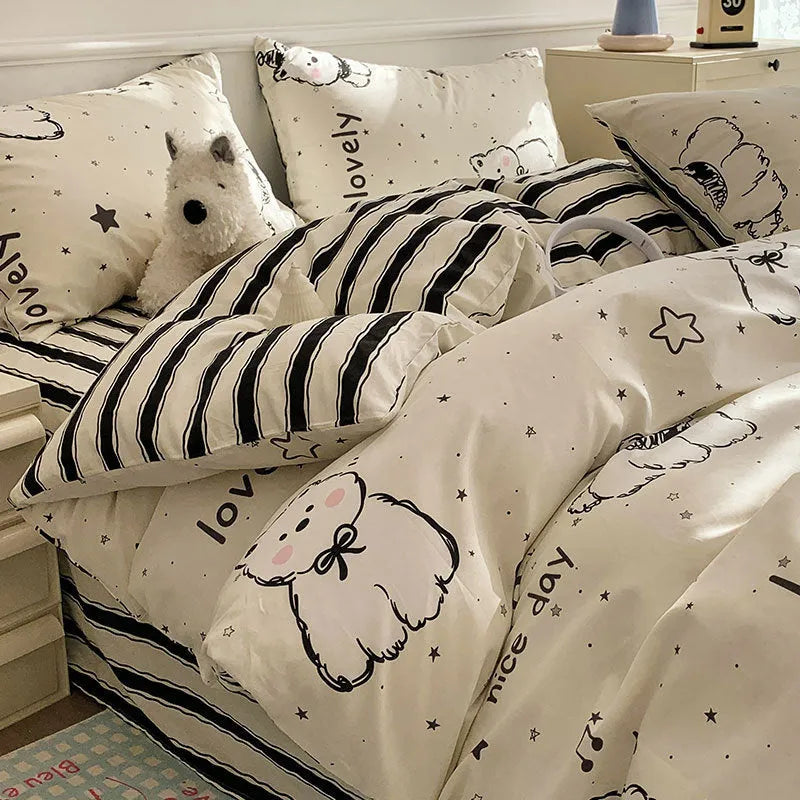Cartoon dog pattern pure cotton duvet cover set with matching fitted sheet and pillowcases on a bed.