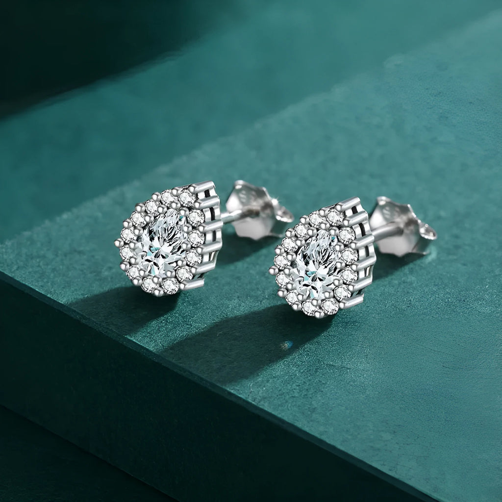 Women's silver water drop ear studs in 925 sterling silver with diamond treatment finish