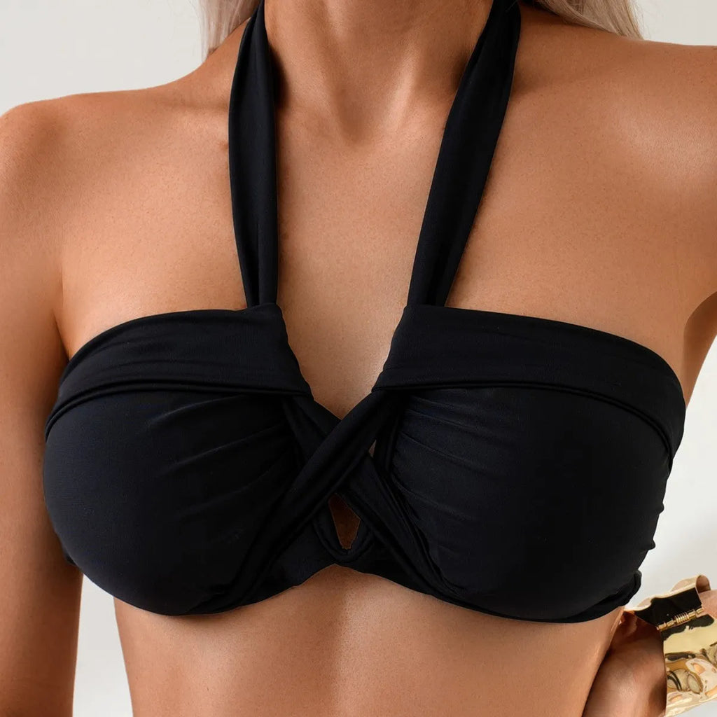 Black women's bikini swimming suit with briefs style and backless design.