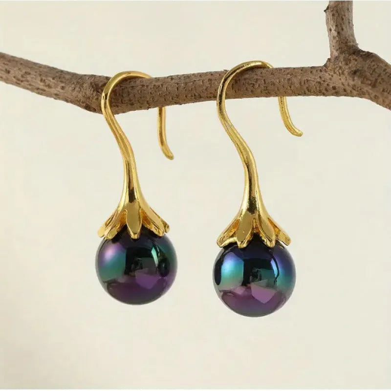 A pair of gold-colour retro fashion earrings for women with an OL style design.