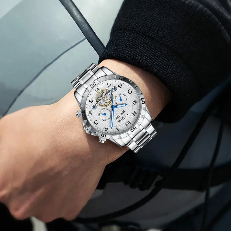 Silver men's automatic perpetual calendar mechanical watch with stainless steel strap and sapphire crystal glass.