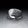 Silver alloy men's ring with a geometric wolf design on a black background.