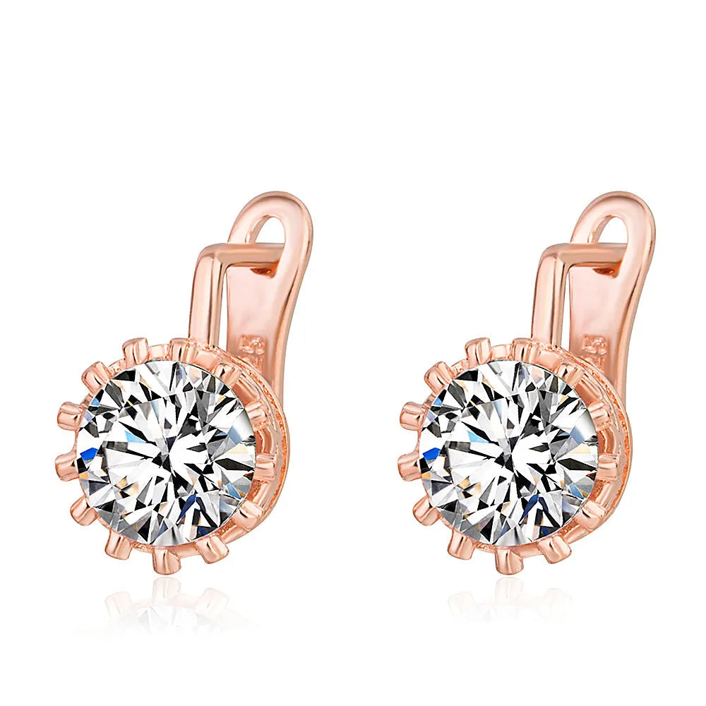 A pair of Korean retro crown-shaped clip-on earrings with a white diamond centre, in a rose gold finish.