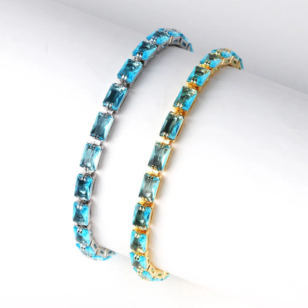 Women's zircon bracelet with electroplated alloy in golden or platinum finish with coloured zircon stones