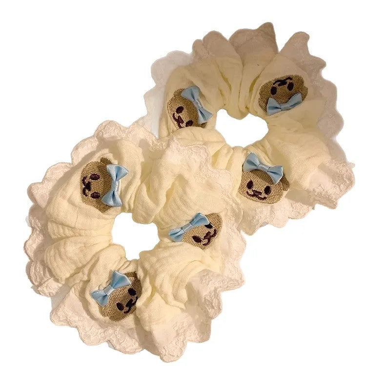Blue bear-themed cloth headband with bow lace decoration and elastic design