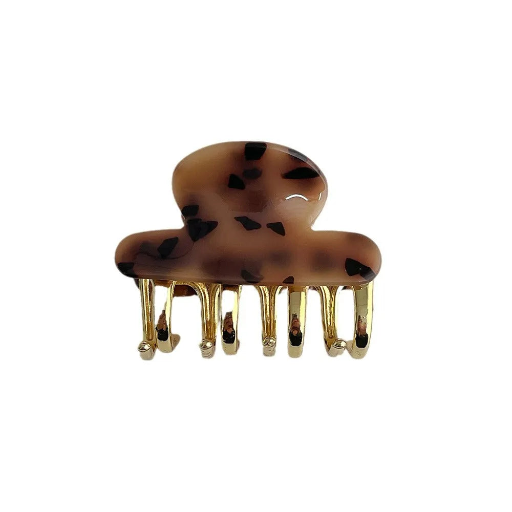 A medium-sized retro acetate hair barrette with a metal grip in a choice of four colours.