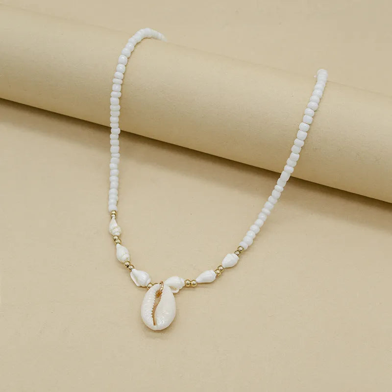 White conch shell bead necklace for women with mother of pearl pendant on a regular chain