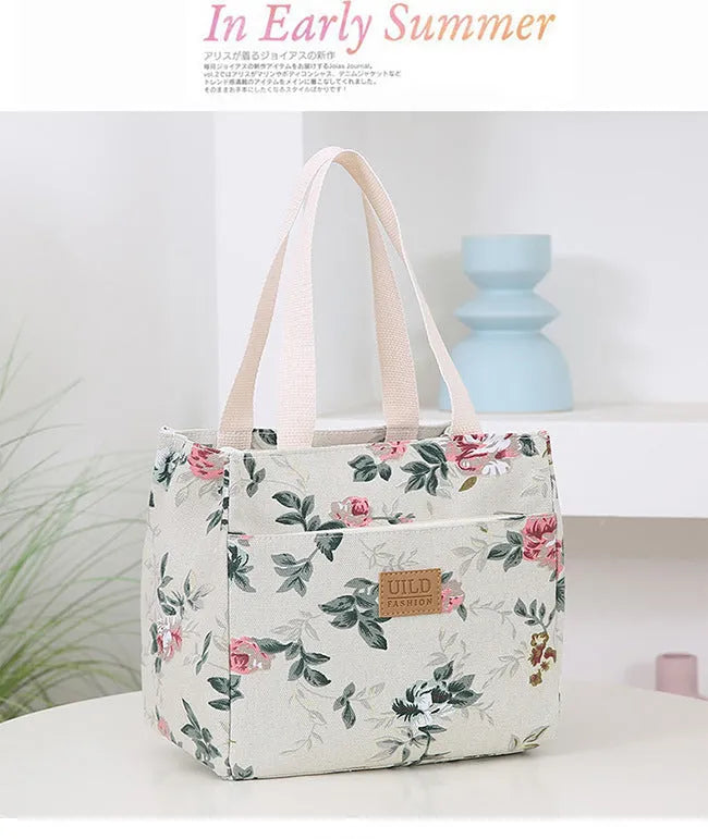 Women's large square canvas handbag with aluminium handles in a choice of printed floral and cat designs.