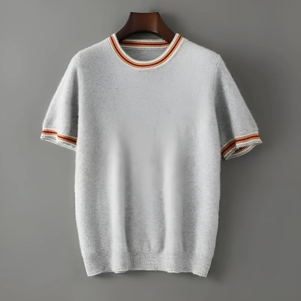 A man's short sleeve grey wool jumper with a round neckline on a hanger.