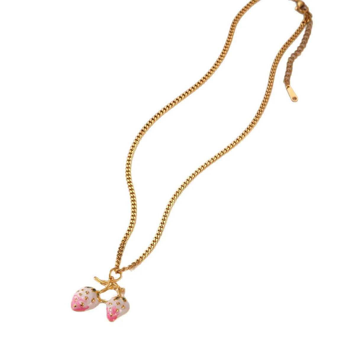 Close-up of a women's stainless steel necklace with a small red strawberry fruit pendant on a silver chain.