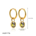 Close-up of women's retro-style copper earrings featuring a single oval-cut zircon stone in an emerald green colour.