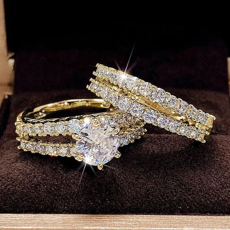 2 in 1 fully jewelled female fashion ring set in silver, gold, and rose gold on a geometric background.