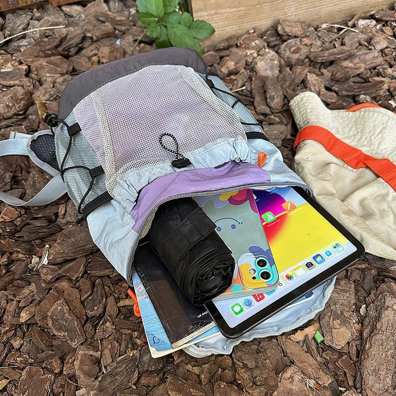 Blue casual waterproof nylon backpack with curved straps and fold design.