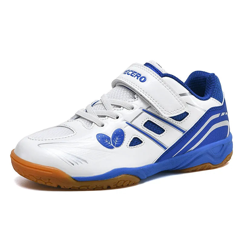 White and blue low-top badminton shoes with a ribbed sole and wedge heel.
