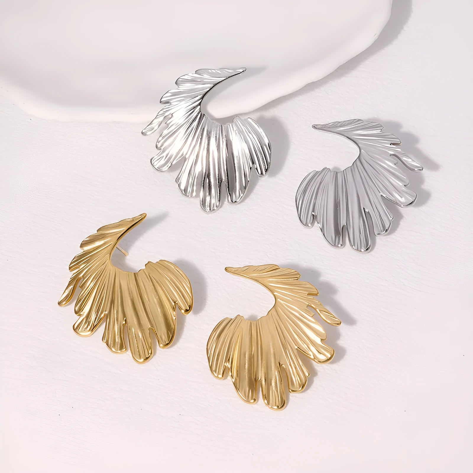 Gold and steel colour stainless steel leaf stud earrings with retro design