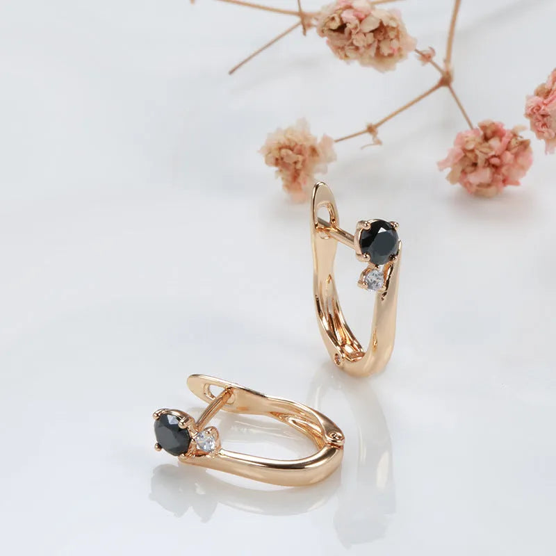 Women's black agate geometric drop earrings with gold plating and ear clip fastening