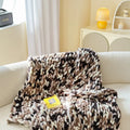 Handmade thick chenille stripe blanket in 130x170cm size shown in caramel mango colour.