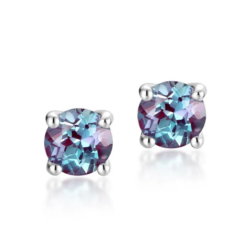 A pair of round geometric stud earrings with a cultivated alexandrite stone set in 925 silver.