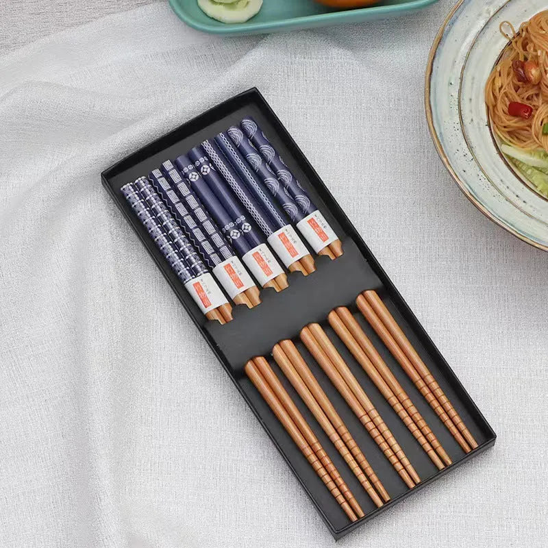 Set of five pairs of bamboo chopsticks with Japanese lucky cat and elegant blue cartoon patterns.