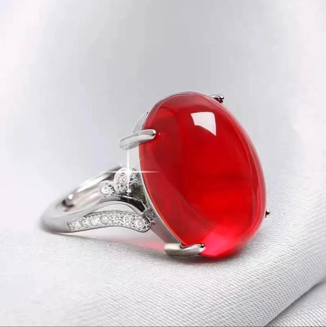 Adjustable geometric alloy ring with a natural sapphire style, shown in multiple colour options.