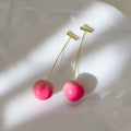 A pair of acrylic earrings featuring a detailed peach fruit design, shown in small and large size options.