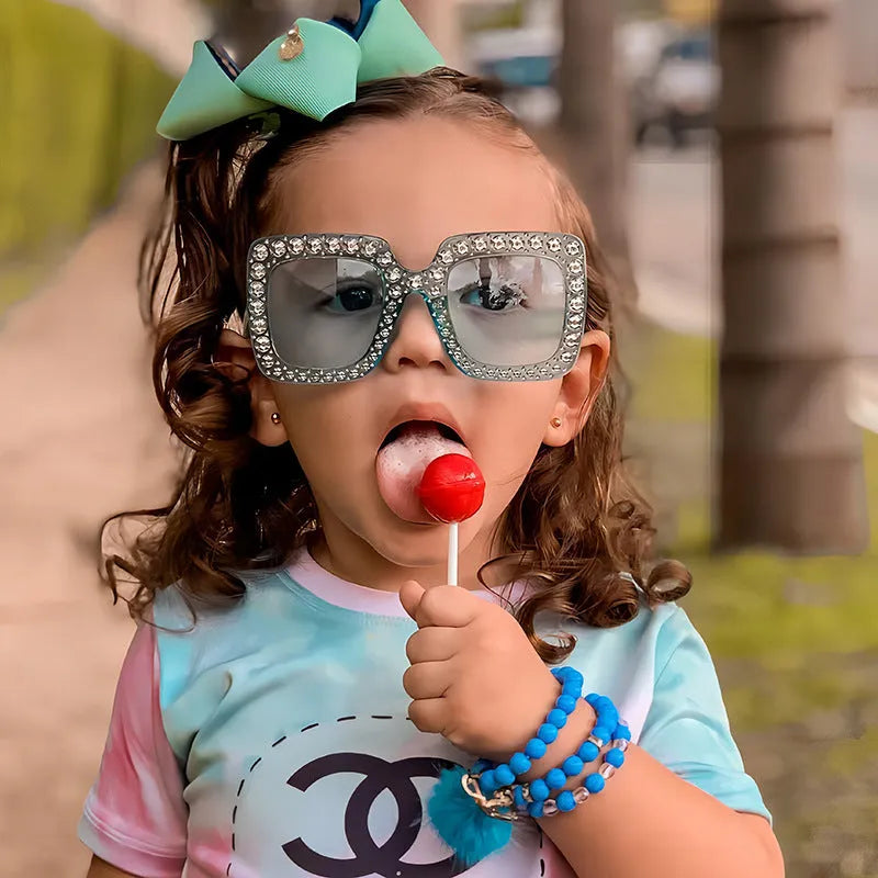 Plastic sunglasses storage box with clear transparent lid showing fashion eyewear inside