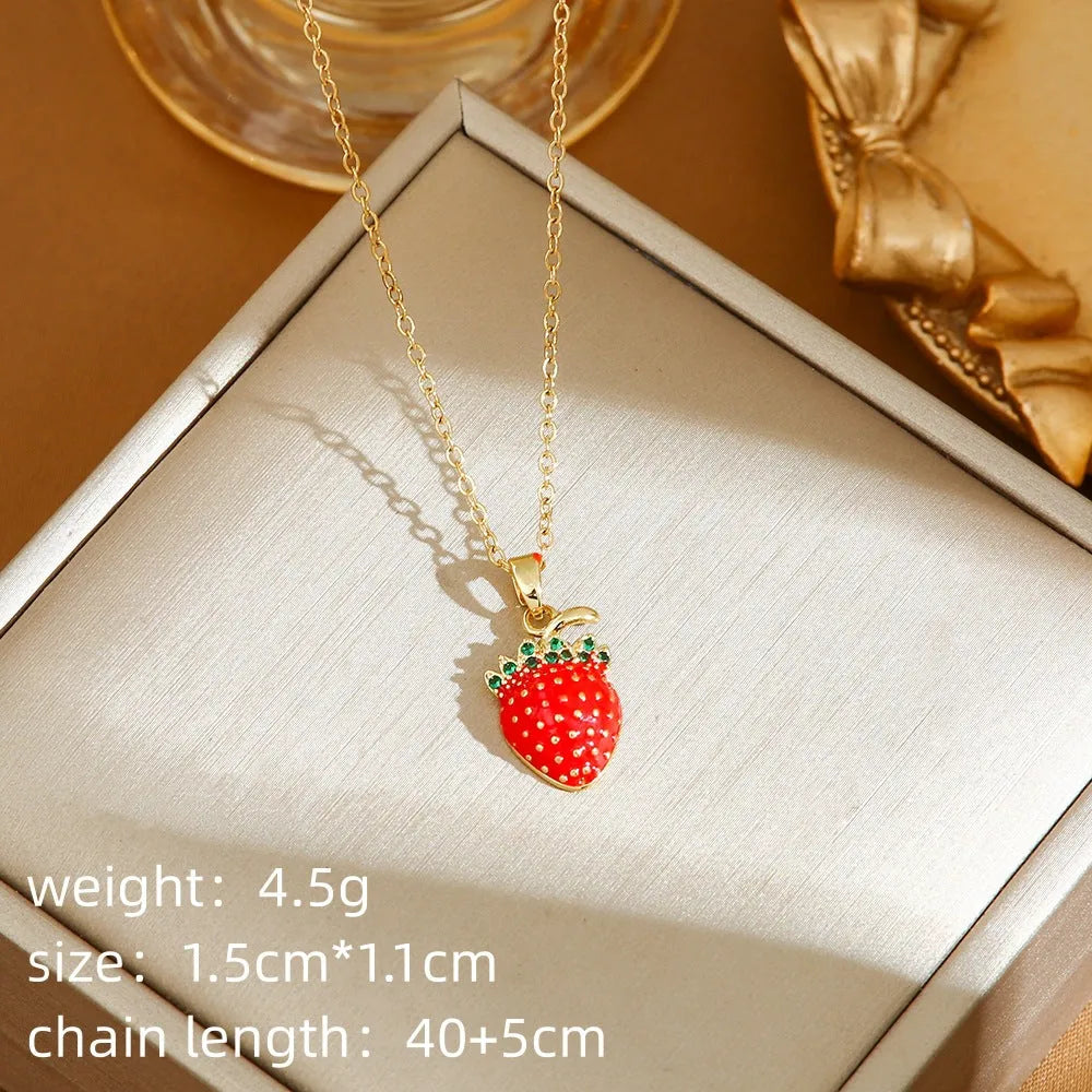 Red delicate indie necklace with cherry charm on a 50cm adjustable titanium steel O-ring chain.