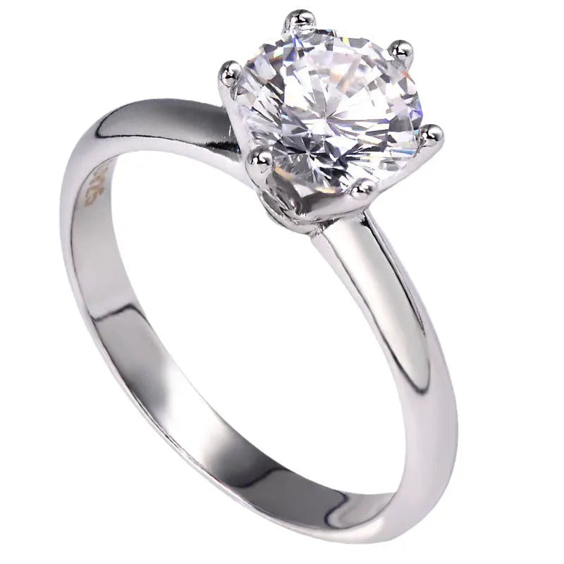 Six-claw inlaid zircon ring with geometric design in white gold plated finish
