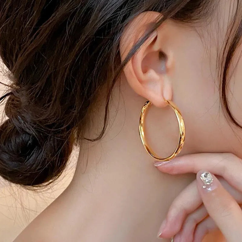 Gold and silver metal circle hoop earrings with 40mm diameter measurement