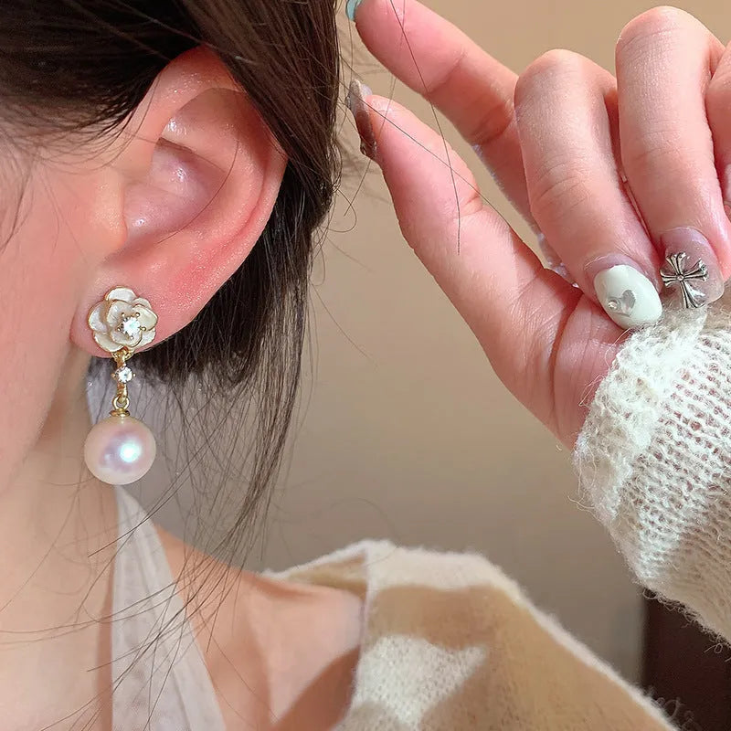 Camellia flower stud earrings in alloy metal with floral design