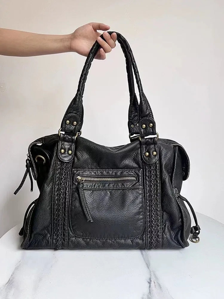 Women's brown soft PU leather retro messenger bag with a single shoulder strap and woven detail.