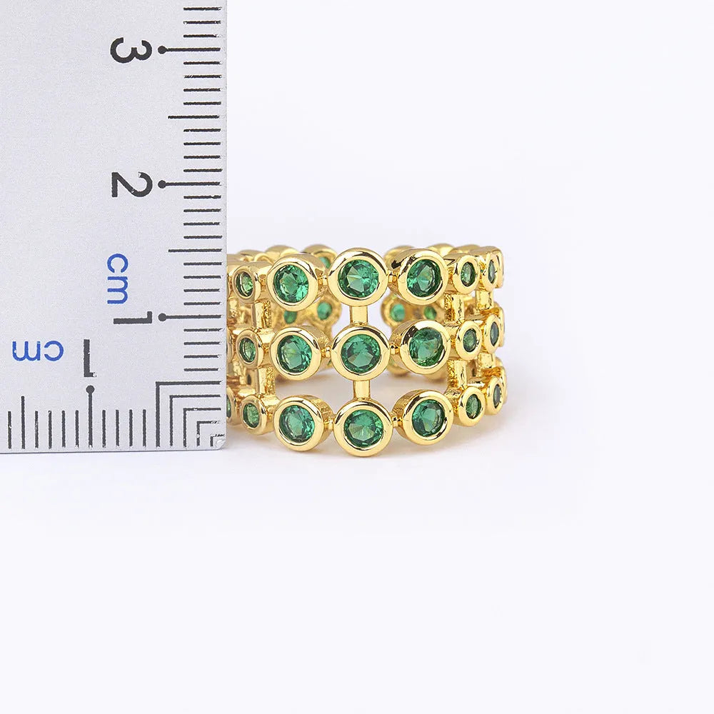 Copper 18K real gold plated wide band ring with green zircon centrepiece.