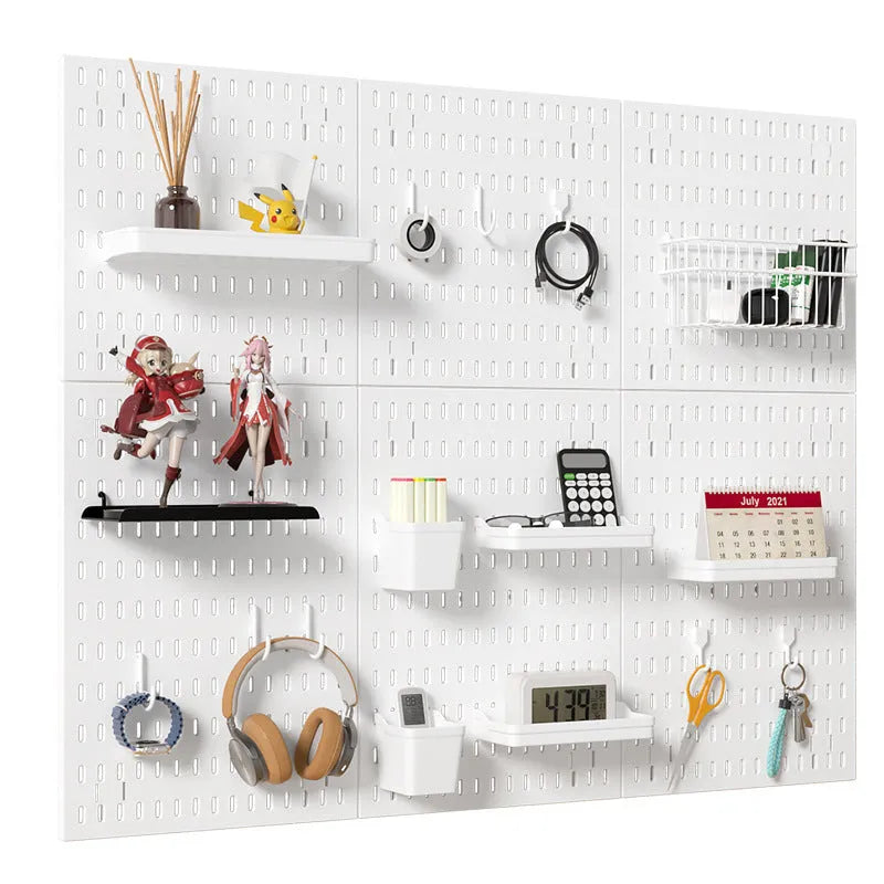 White punch-free wire wrap board storage rack mounted on a wall organising cables.