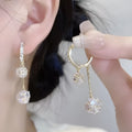 Silver drop earrings with rhinestone ball, balloon charm and tassels on ear clip fitting