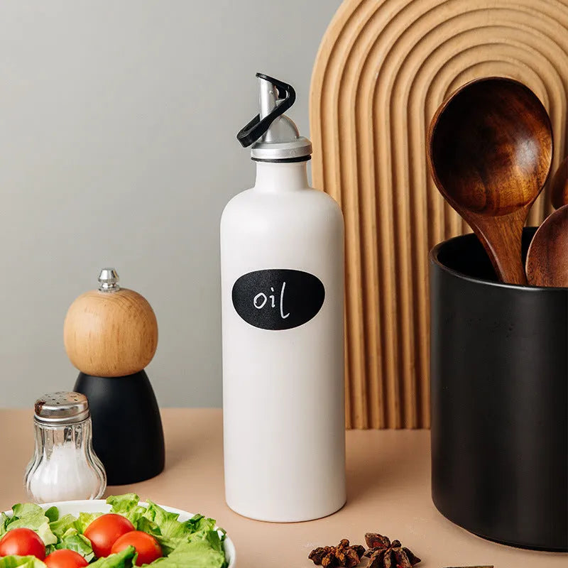 Ceramic oil pot with integrated funnel for kitchen oil storage in 650ml capacity