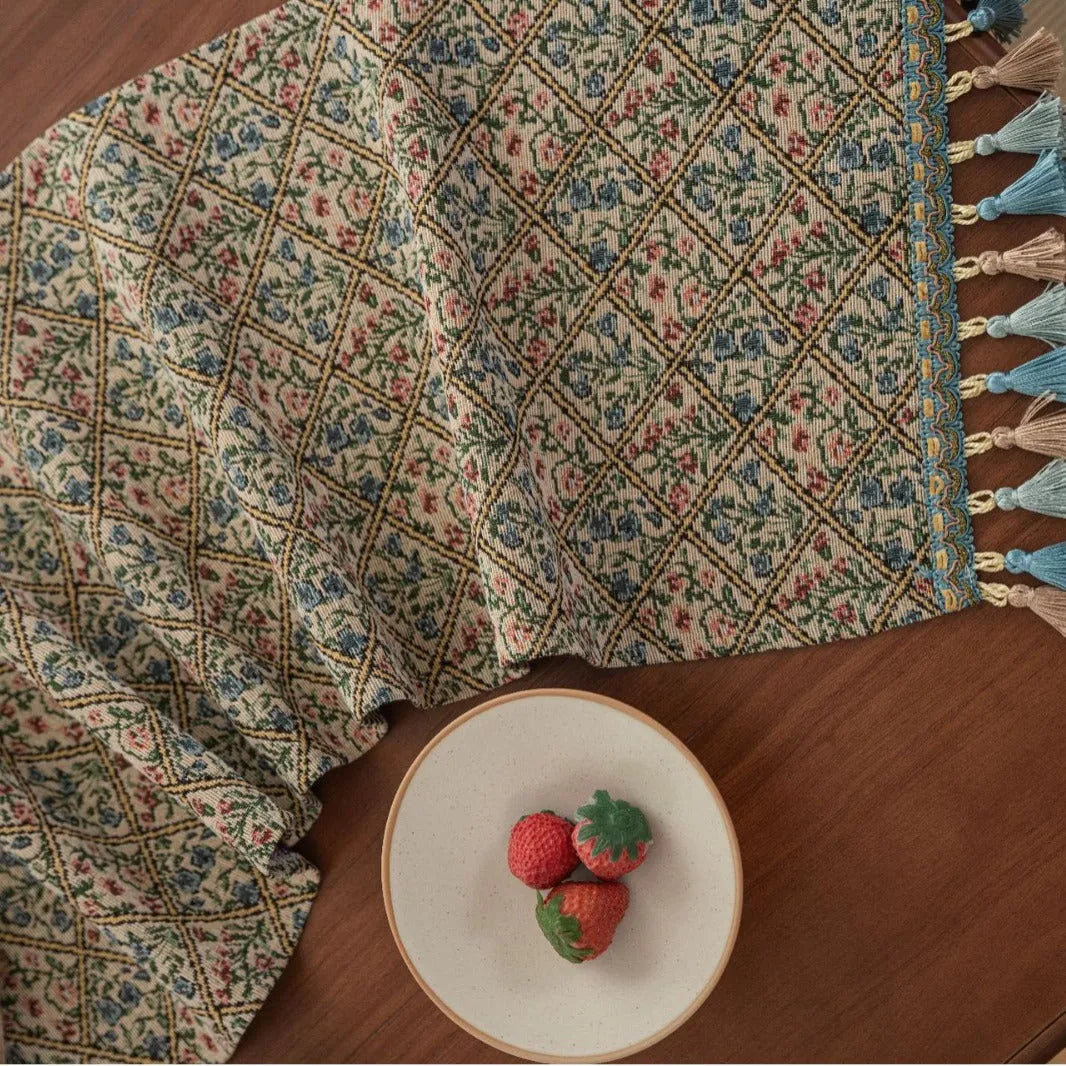 Rhyme Nordic Jacquard table runner with bouquet stripe pattern and tassel trim on dining table