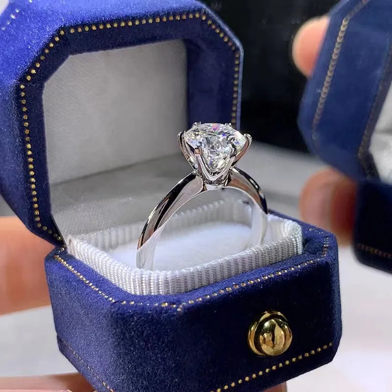 Six-claw inlaid zircon ring with geometric design in white gold plated finish
