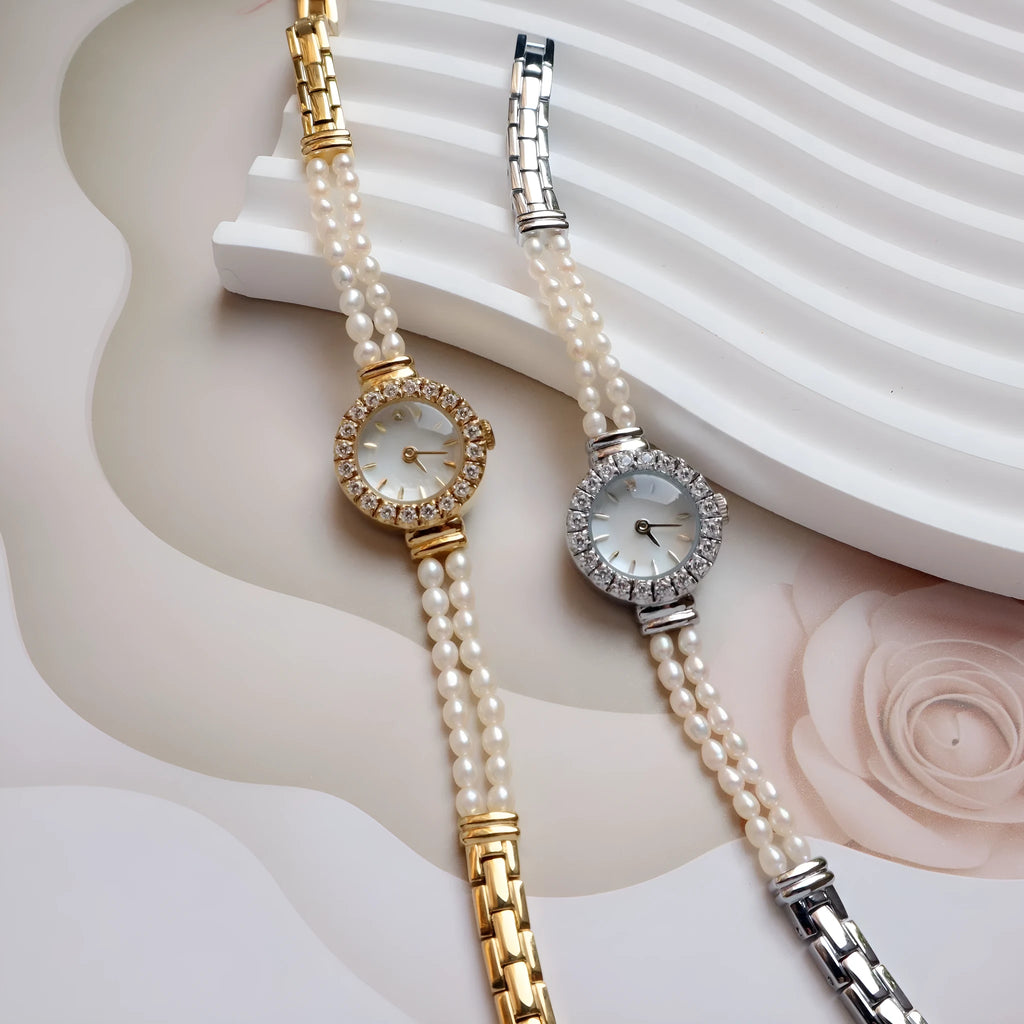 Light gold women's freshwater pearl bracelet watch with round dial on stainless steel strap.