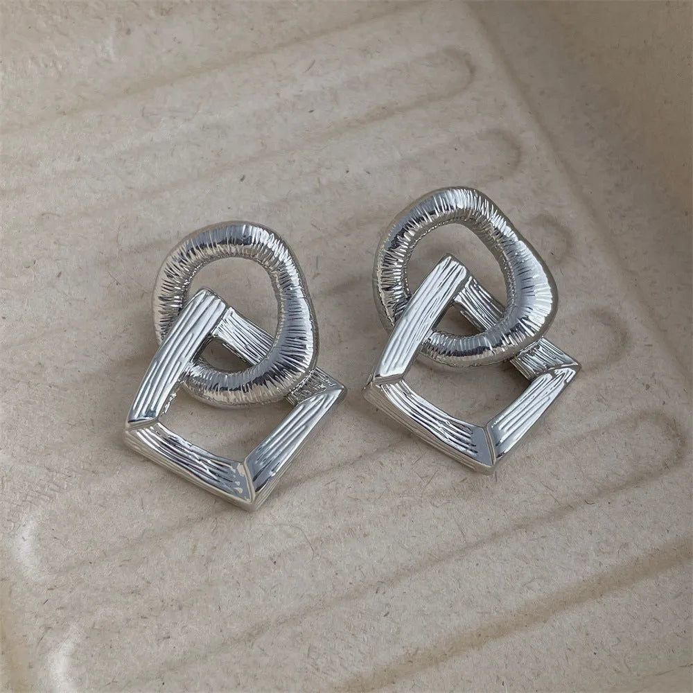 Retro geometric circle pendant earrings in gold or silver finish measuring 3.4cm height