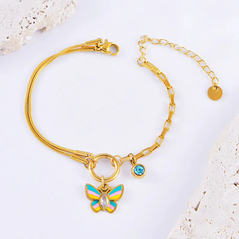 Gold titanium steel butterfly necklace and bracelet set with epoxy colour detailing on animal zodiac pendant