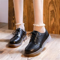 Women's preppy style black and brown retro Mary Jane lace-up pumps with low square heel.