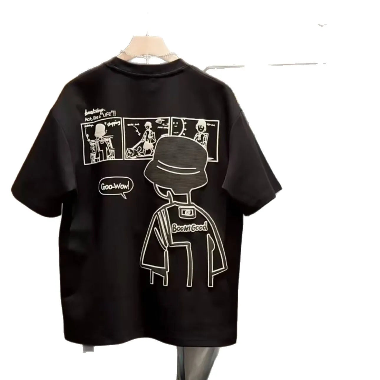 Men's black cotton t-shirt with a cartoon print, showing crew neck and short sleeve design on a hanger.