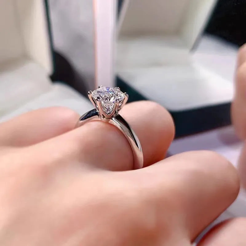 Six-claw inlaid zircon ring with geometric design in white gold plated finish