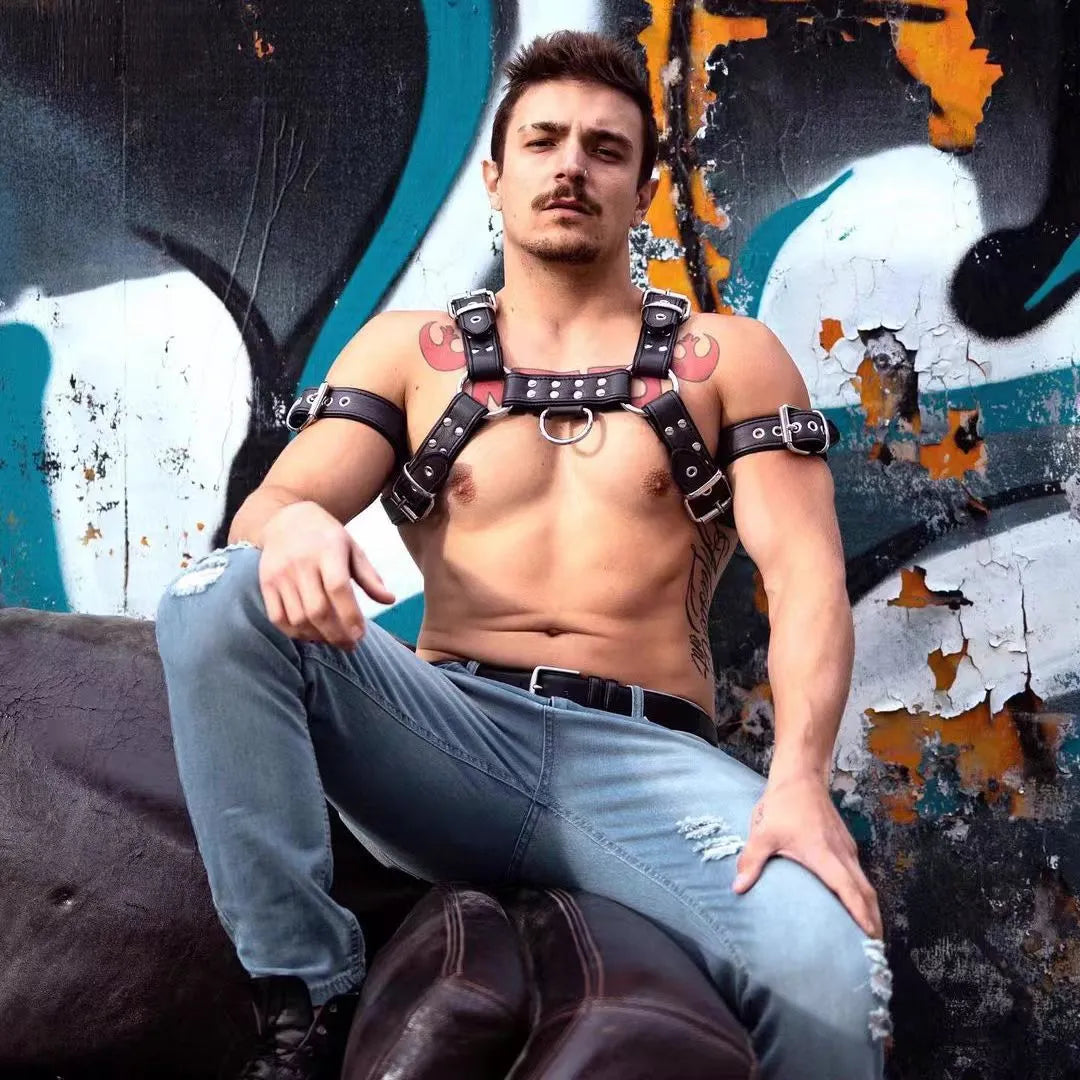 Black leather adjustable chest harness strap with metal buckle for men's costume and performance use
