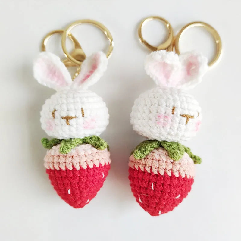 Hand-woven white doll wire pendant with a rabbit strawberry charm and an attached key