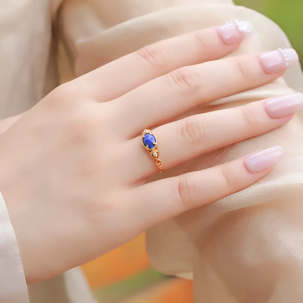 Japanese style silver alloy ring with blue lapis lazuli stone in an elliptical geometric shape.