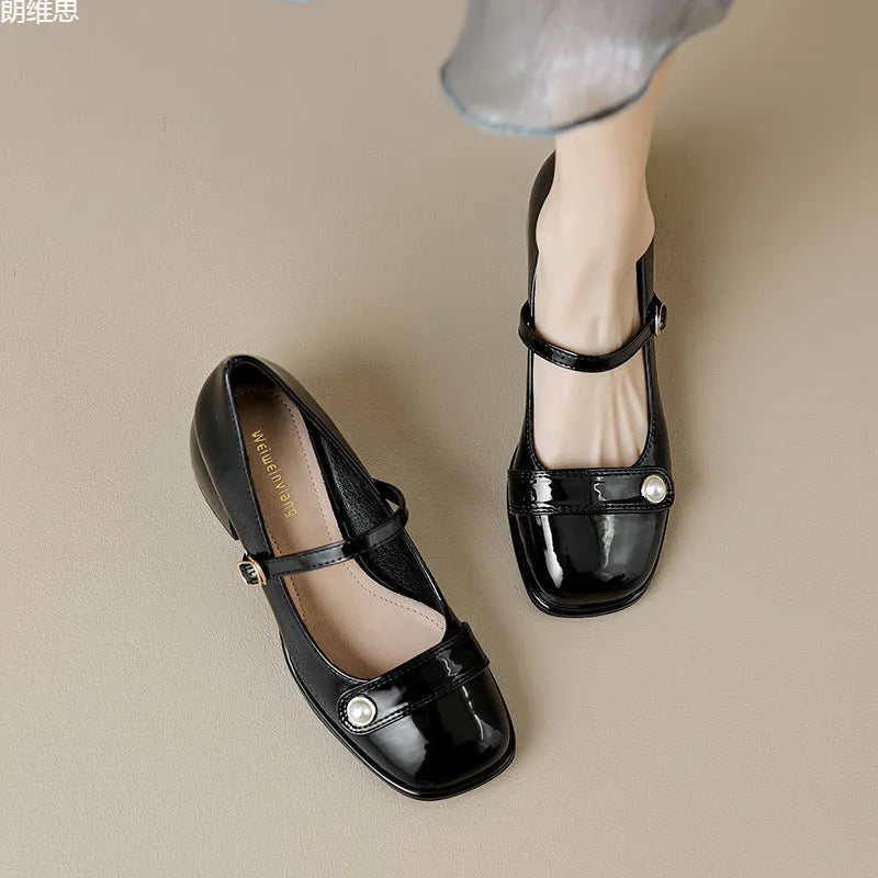 Women's apricot patent leather ankle boots with a chunky heel and ankle buckle.